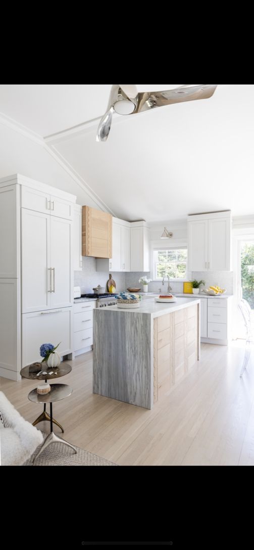 Open Gourmet Kitchen With Glass Sliders Leading To Backyard