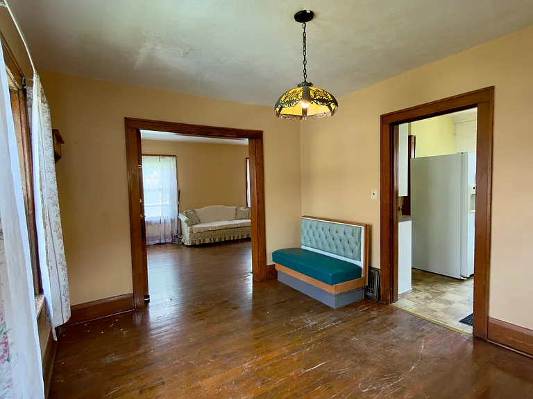 Dining room (with view of living room on the left side, and kitchen to the right)
