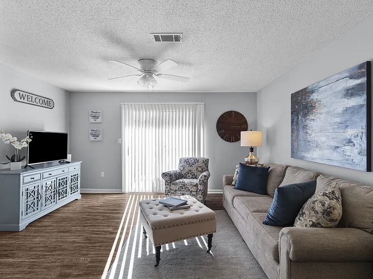 Relax and unwind in the spacious living areas at Lakeland East Apartments in Flowood, MS. Managed by Highlands Vista Group.