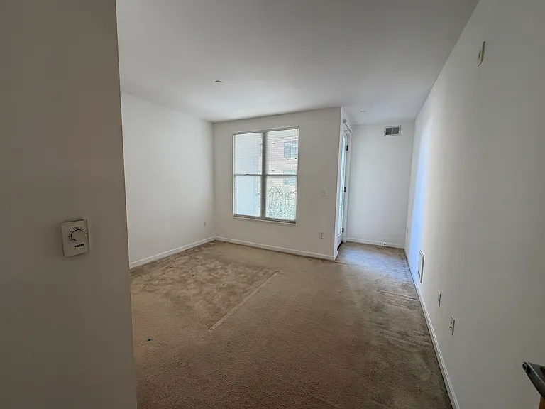 Nook area of bedroom. Small desk fits.