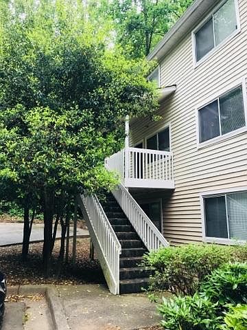 Stairs leading up to private entrance and front porch