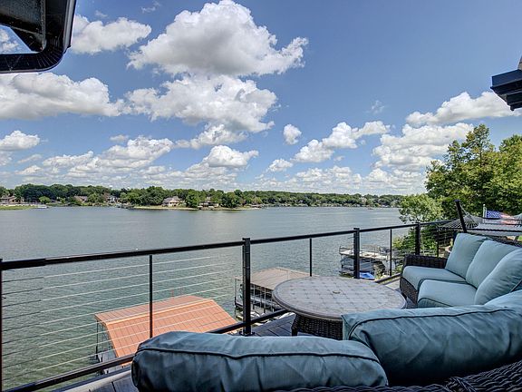 Unobstructed view from your beautiful Trex deck connected to both the screened in porch and the primary 1st floor bedroom.