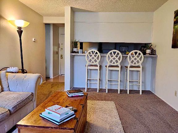 Looking towards entry and kitchen