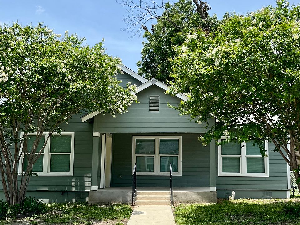Front of house. Large welcoming porch. All new energy efficient windows.