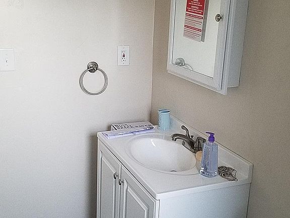 Even new bath vanity, lights and floor.