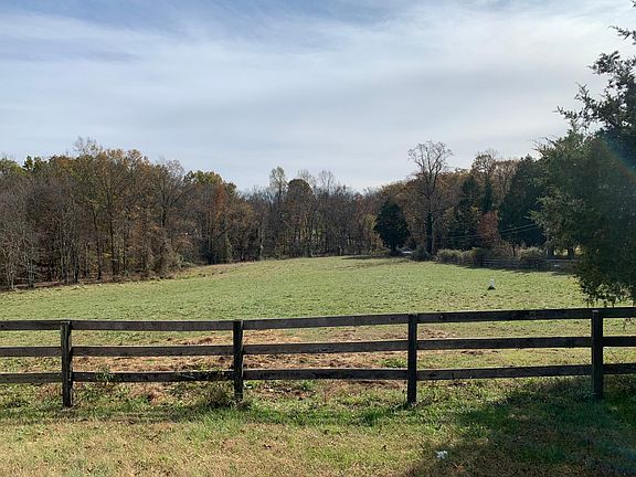 3 acre fenced pasture with stream and plenty of shade; suitable for up to three horses (yours or boarders). Barn has electricity and running water.