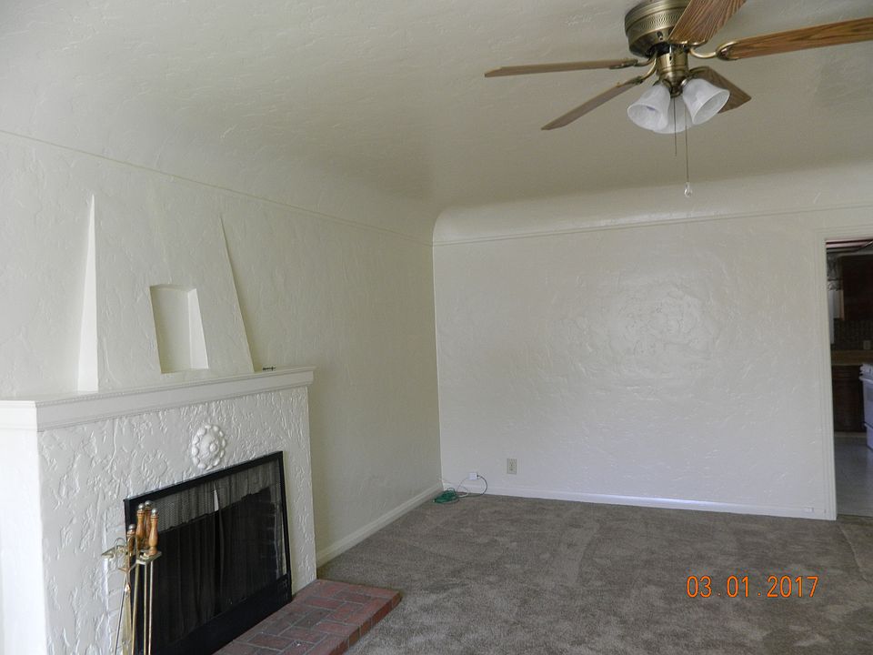 living room with wood burning fire place