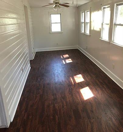 Large living room with lots of natural light