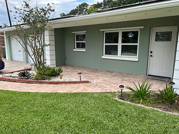 Front of home-with paver seating area.