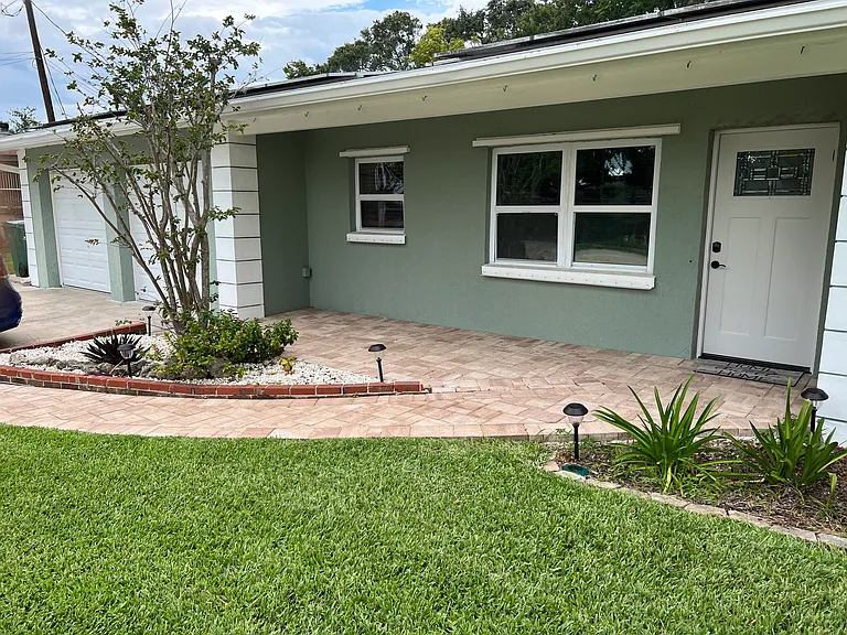 Front of home-with paver seating area.