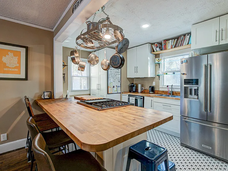 stainless Kitchen Aid Appliances and Penny Tile floor at 907 W Wendover ave