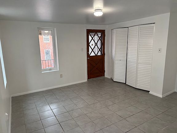 living area with closet and access to balcony