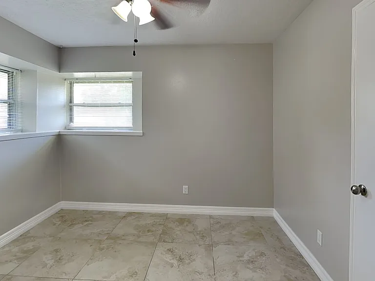 Brightly lit corner room with