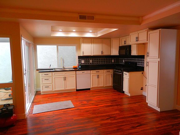 new kitchen with new stove.kitchen opens to private patio