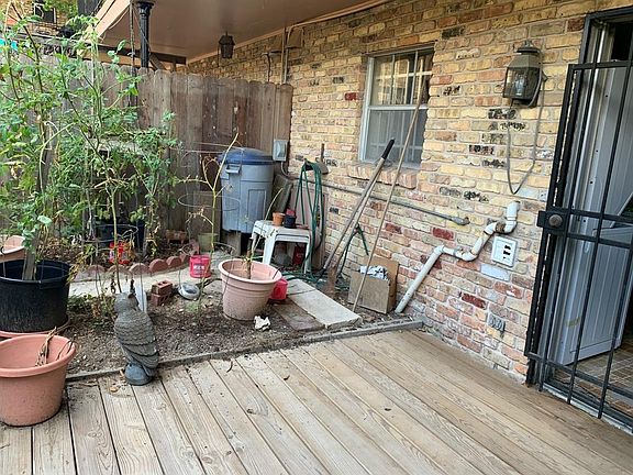 Backyard patio with room for a garden.