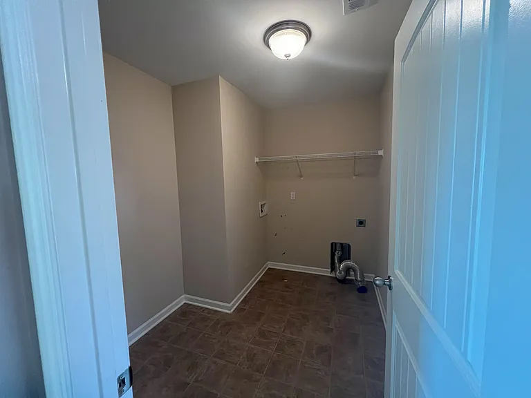 Located upstairs by the master bedroom across from linen closet.
