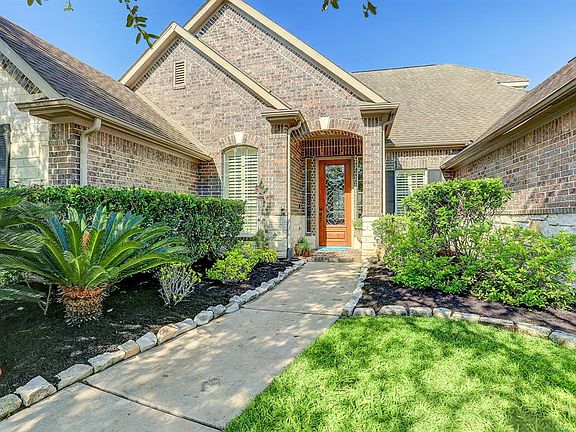 Lush landscaping with stone/brick elevation boast great curb appeal.
