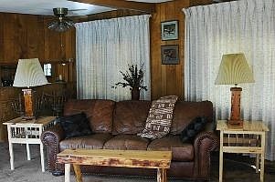 Living Room with eating bar in background