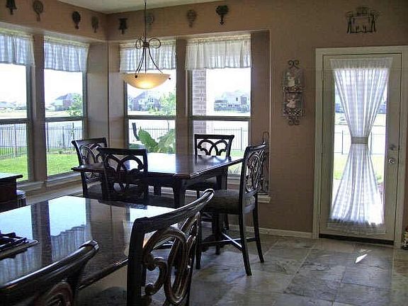 The sunny breakfast nook also overlooks the lake.