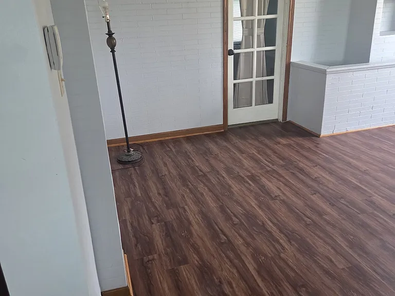 Living Room with Faux Brick Accent & Natural Light