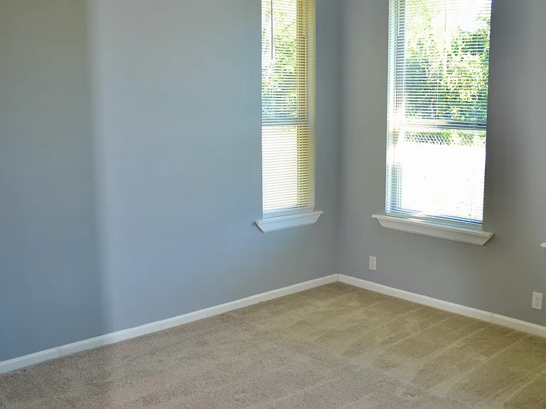 master bedroom with lots of windows
