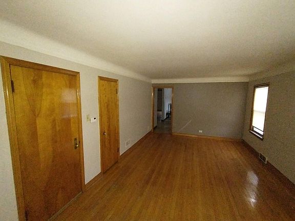 Living room looking south, coat closet on left