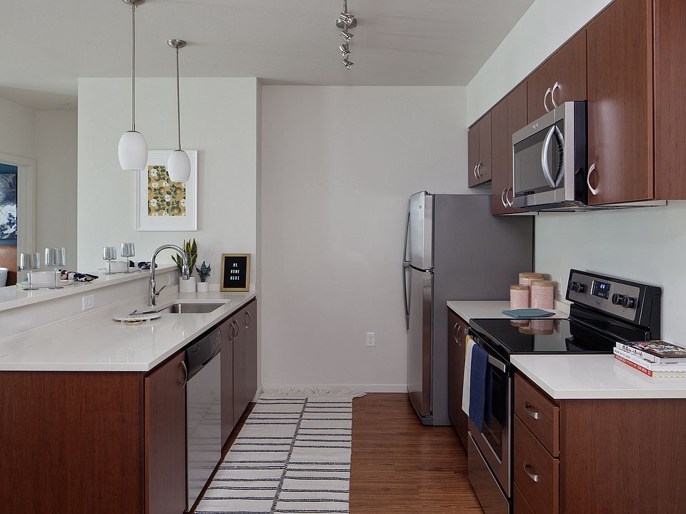 Grant Park Village side kitchen shot showing dark cabinets and appliances