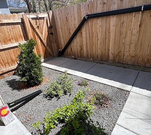Gate to porch and entrance to house