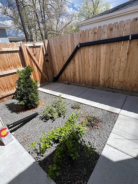 Gate to porch and entrance to house