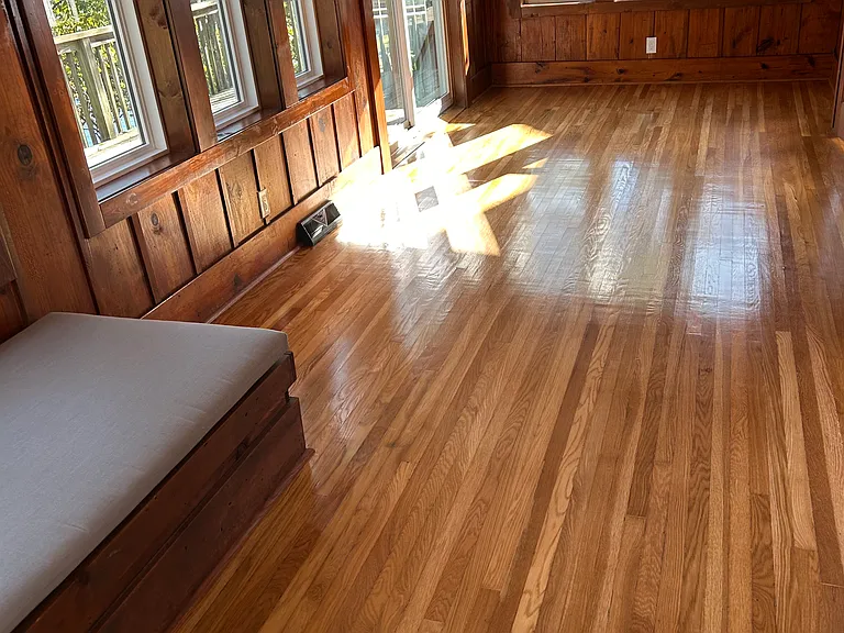 Four season porch with slider to deck on the lake side.