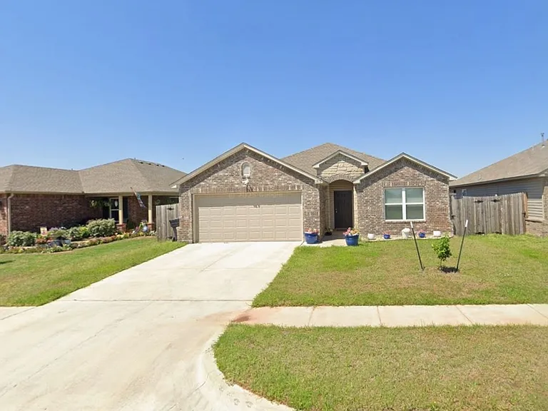 Front of the house. Spacious two car garage and drive way