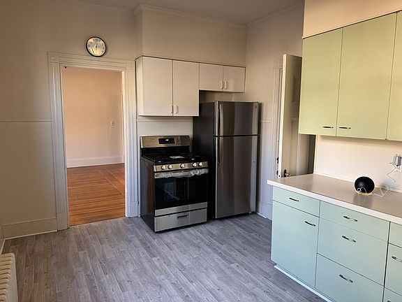 Kitchen with brand new Refrigerator, Stove and new floor