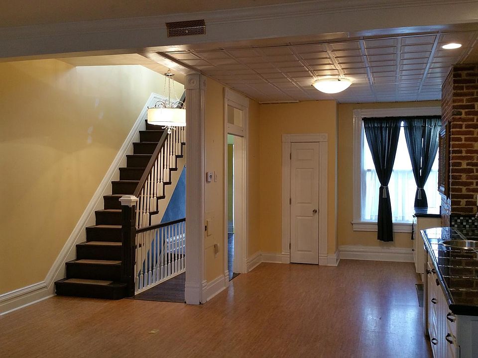 Open concept living and dining area - includes a built in media center, wet bar, cork floors, and TONS of storage.