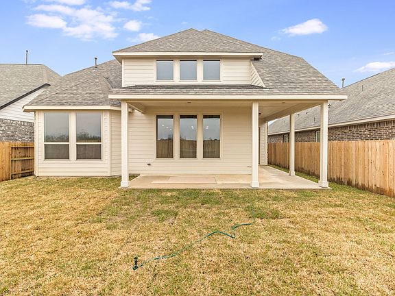Come and see this spacious backyard with a covered patio There is plenty of room for the kids to pl