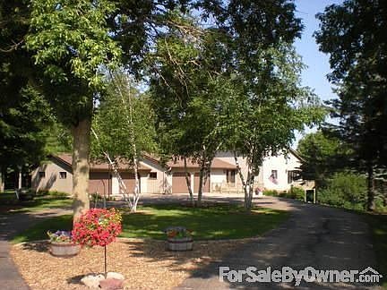 Front View
						:
						Attached 4-car garage, asphalt driveway, beautiful mature trees