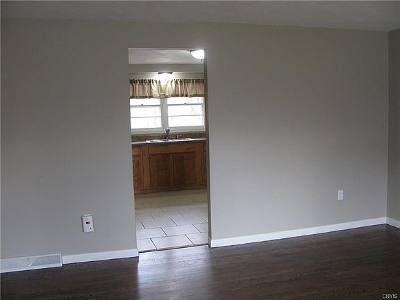 Enter into the Front Door and catch a view of the well lit Updated Kitchen that boasts Ceramic Tile flooring and even more windows!