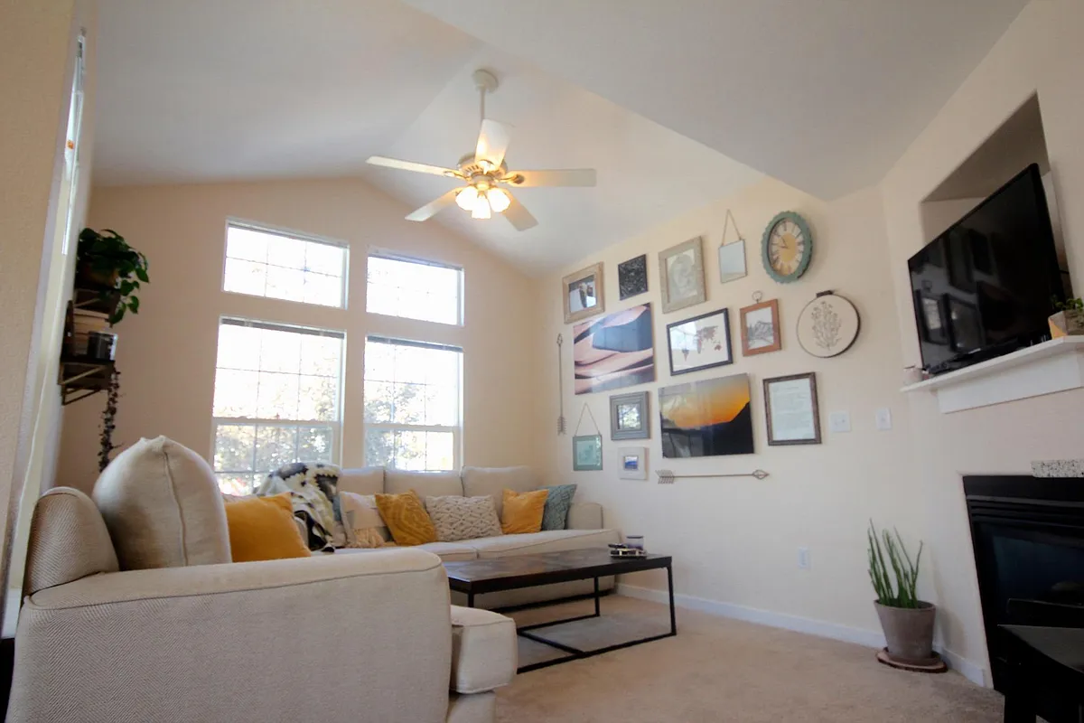 vaulted ceiling in living room and a cozy gas firplace - 814 Beauprez Ave