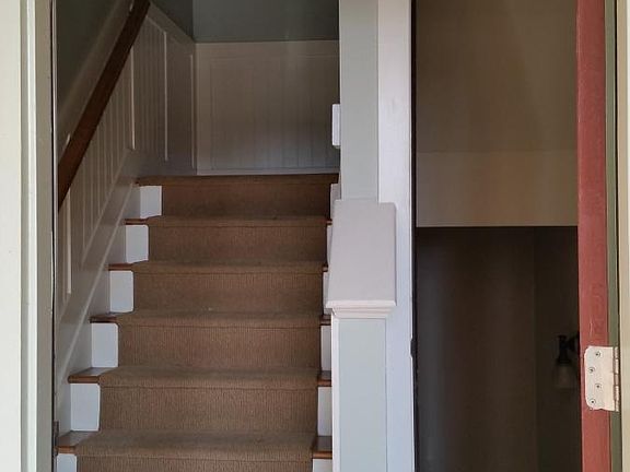 Stairs up to main floor, down to garage