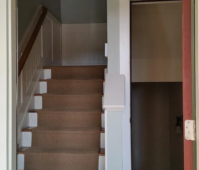 Stairs up to main floor, down to garage