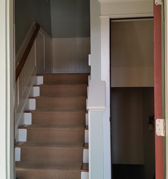 Stairs up to main floor, down to garage