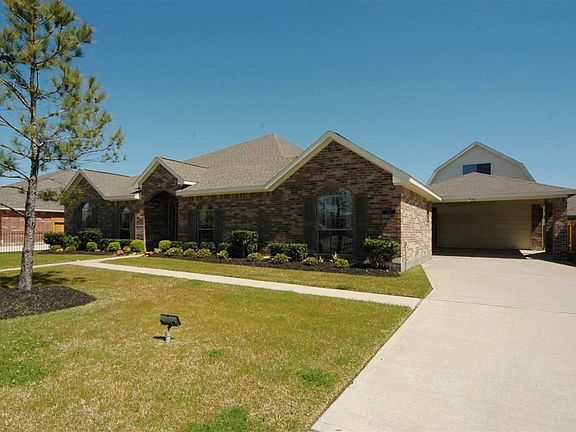 Fully-bricked front with huge detached garage.