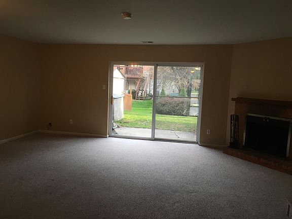 Spacious living/dining room with fireplace