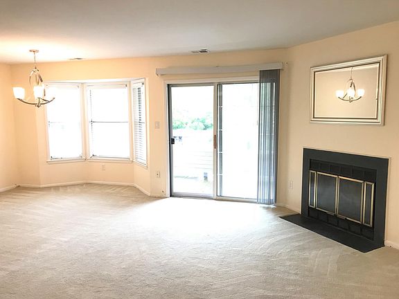 Open living room and dining layout with fireplace and outdoo