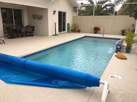 Pool includes a privacy wall