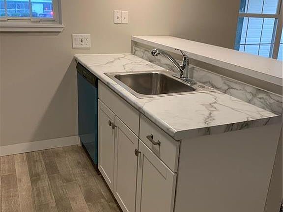 Kitchen includes breakfast bar