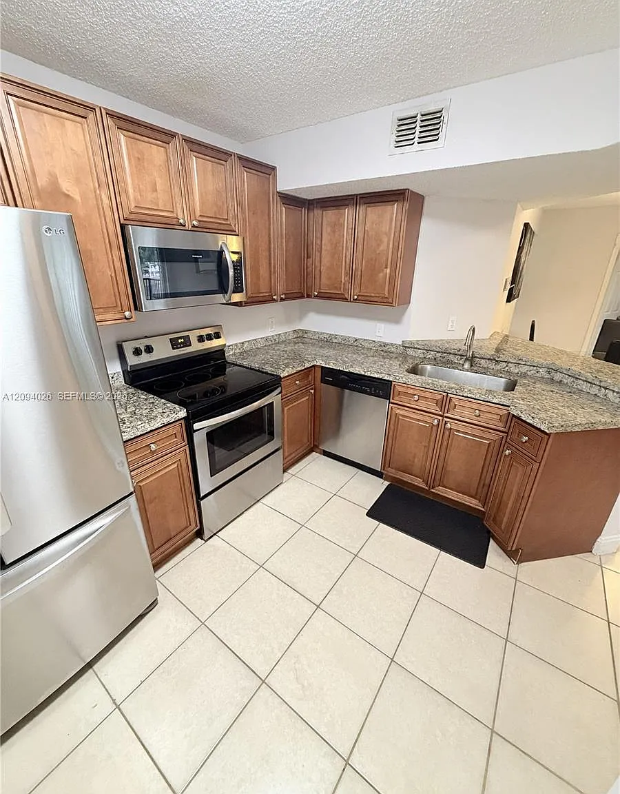 8741 Wiles Rd — Photo 3