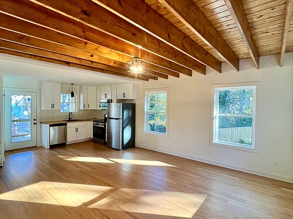 Stunning exposed wood beam ceilings in living room