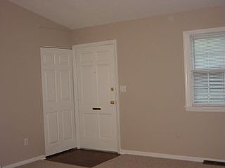 Living room and all bedrooms are painted a nice neutral taupe color with new berber carpet.
