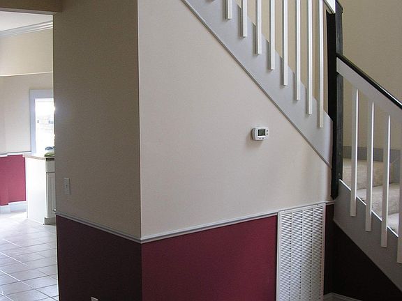 Living Room with Stairs Look to Kitchen