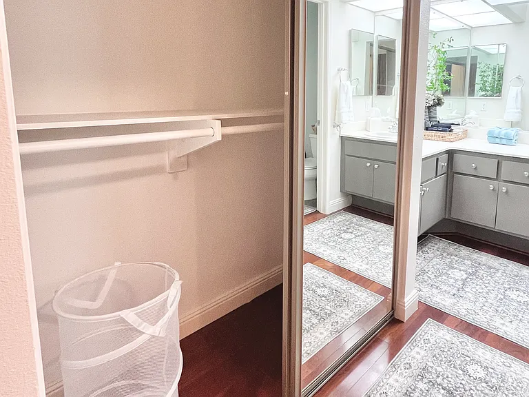 Stay organized together in the extra mirrored closet, thoughtfully designed with plenty of space for couples.